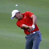 Jordan Spieth hits a shot at the Tournament of Champions in Kapalua, Hawaii, on Saturday. Strong finish gives Spieth five-shot lead