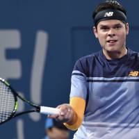 Milos Raonic hits a shot during his win over Roger Federer in the final of the Brisbane International on Sunday. | AFP-JIJI
