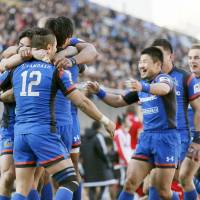 Wild Knights players celebrate during their victory over the Steelers on Saturday at Prince Chichibu Memorial Rugby Ground. | KYODO