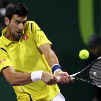 Novak Djokovic plays a shot during his 6-1, 6-2 win over Rafael Nadal in the final of the Qatar Open in Doha on Saturday. Djokovic touches perfection in Doha final win over Nadal