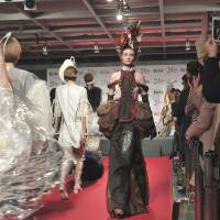 Models walk the runway in a chocolate-inspired fashion show in the Shinjuku NS Building on Jan. 26, the press day for the Salon du Chocolat 2016 Isetan, which boasts creations from about 100 chocolatiers from 19 countries. | YOSHIAKI MIURA