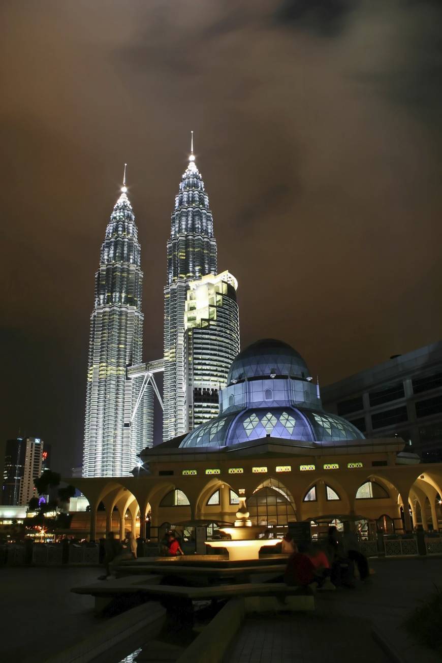 A night view of the Petronas Twin Towers and the As Syakirin Mosque in Kuala Lumpur