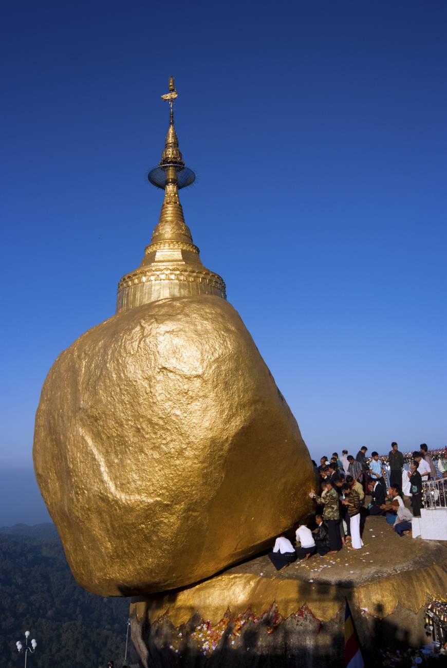 Pilgrims gather around the Golden Rock at the top of Mt. Kyaiktiyo.