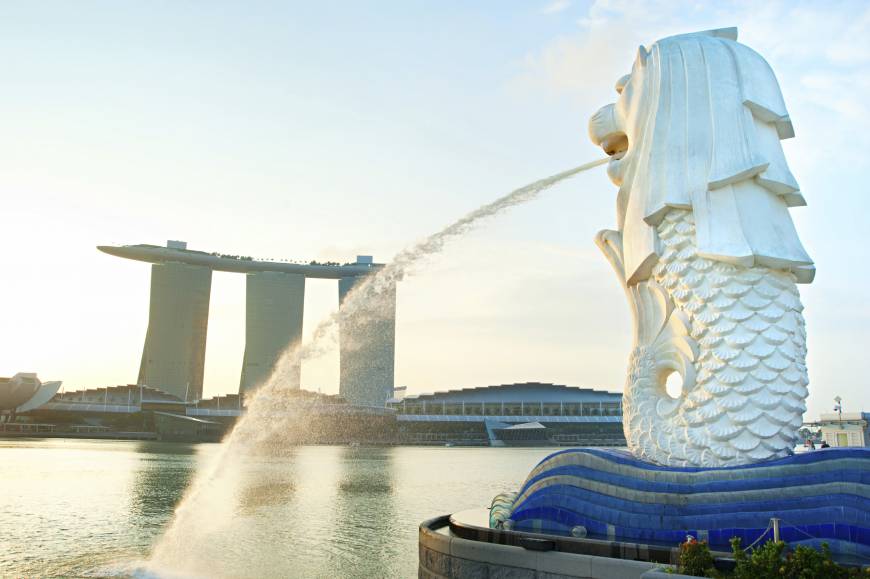 The Merlion fountain spouts water in front of the Marina Bay Sands Hotel.