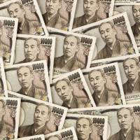 Global uncertainty has sent investors scurrying for safety, bolstering the yen to the dismay of Japan\'s exporters. | BRIGITTE JANDA