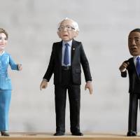 A Bernie Sanders action figure prototype is displayed with Hillary Clinton and Barack Obama figures in a photo illustration taken in the Brooklyn borough of New York Thursday. A Brooklyn product design company, FCTRY, created a prototype for the 6-inch (15-cm) tall plastic version of the U.S. senator from Vermont and started a Kickstarter campaign with a goal of raising $15,000 to fund production. | REUTERS