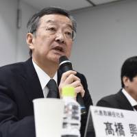 Sharp Chief Executive Officer Kozo Takahashi speaks during a news conference on Thursday in Tokyo. He said neither of its potential partners is preferred over the other at this point. | KYODO