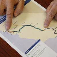 Dan Richard, chairman of the board that oversees the California High-Speed Rail Authority, shows a map of the proposed initial construction of the bullet train on Thursday in Sacramento. | AP
