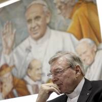Cardinal George Pell is seen on March 31 last year in Rome. In a public hearing Sunday, Pell admitted the Church has highs and lows, saying that for good or ill \"it follows the patterns of the societies in which it lives.\" | AP
