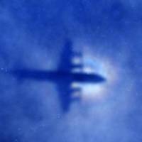 The shadow of a Royal New Zealand Air Force P3 Orion maritime search aircraft is seen on low-level clouds as it flies over the southern Indian Ocean looking for missing Malaysian Airlines Flight MH370 in March 2014. Site of missing MH370 may be lost forever