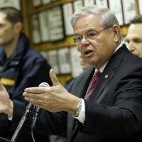 U.S. Sen. Bob Menendez speaks about President Barack Obama\'s planned trip to Cuba during a news conference Thursday in Union City, New Jersey. Obama said Thursday he\'ll raise human rights issues and other U.S. concerns with Cuban President Raul Castro during a history-making visit to the communist island nation. The brief visit in mid-March will mark a watershed moment in relations between the U.S. and Cuba, making Obama the first sitting U.S. president to set foot on the island in nearly seven decades. | AP
