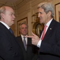 Cuban Minister of Foreign Trade and Commerce Rodrigo Malmierca Diaz meets a gesturing U.S. Secretary of State John Kerry in Washington Thursday. | ISMAEL FRANCISCO / CUBADEBATE VIA AP