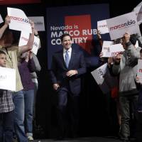 Republican presidential candidate Sen. Marco Rubio walks up to the stage at a rally Monday in Reno, Nevada. | AP