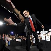 Republican U.S. presidential candidate Marco Rubio greets supporters during a campaign stop at the U.S. Space and Rocket Center in Huntsville, Alabama, on Saturday. | REUTERS