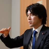 Lower House lawmaker Kensuke Miyazaki is interviewed in Tokyo on Friday. Critics, including from his own party, have condemned him for seeking paid time off work. Japanese lawmaker's paternity leave clashes with men-stay-at-work mindset