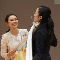 Chiaki Akada, who won the top prize in the apparel category, recommends clothing while offering tips on style during a role-playing competition for sales clerks on Jan. 22 in Yokohama. | MAGDALENA OSUMI