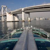 The tour boat Hotaluna, designed by cartoonist Leiji Matsumoto, gives passengers a view of the Rainbow Bridge on Feb. 4. Tokyo sightseeing boats offer unique views, but missing foreign tourist tide