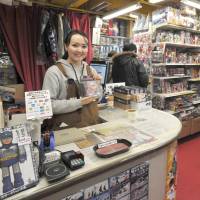 Zhansaya Baigaziyeva from Kazakhstan is one of many non-Japanese staffers working at the Mandarake stores. | YOSHIAKI MIURA