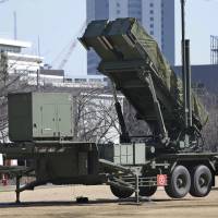 A Self-Defense Forces PAC-3 Patriot missile battery stands at the Defense Ministry in Tokyo on Sunday. | AP