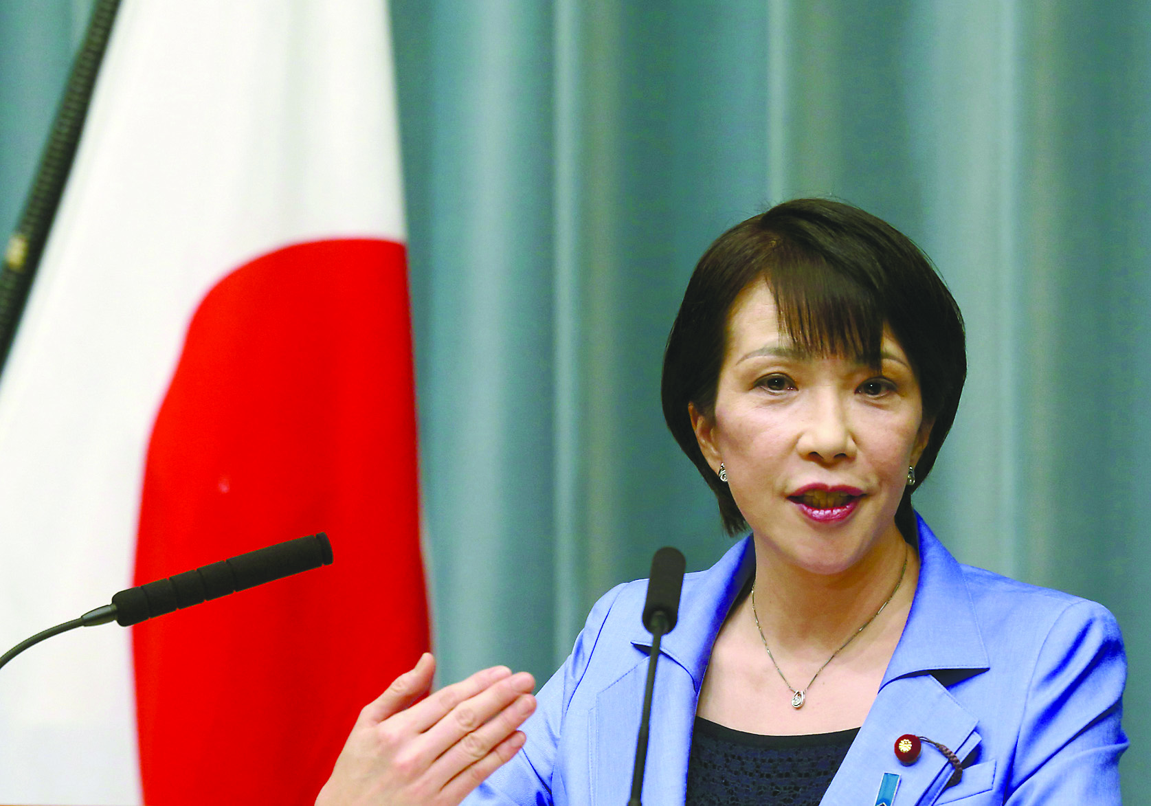 Internal Affairs and Communications Minister Sanae Takaichi speaks during a news conference at the prime minister's official residence in Tokyo in September 2014. | BLOOMBERG