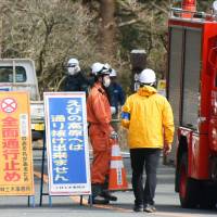 Roads near Mount Io in Ebino, Miyazaki Prefecture, are closed off to traffic Sunday after the Meteorological Agency warned the volcano might have a small eruption. | KYODO