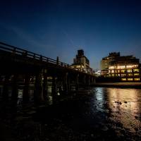 On a night stroll in Kyoto, past Sanjo Ohashi and the Kamo River. | BENJAMIN PARKS