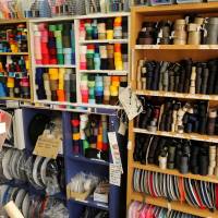Tokyo Vinyl\'s walls are lined with colorful straps. | KIT NAGAMURA