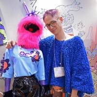 Designer Brandon Reierson poses with one of his designs at the Rooms fashion and lifestyle trade fair in Tokyo. | SAMUEL THOMAS