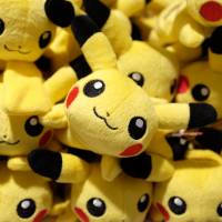 Pikachu plush toys are displayed for sale at the Pokemon Center Mega Tokyo store. Since Pokemon\'s launch 20 years ago, Pikachu has become recognizable around the world. | BLOOMBERG
