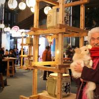 Artist Shoji Ryo and his dog Jackie at Craft Sake Week. | MONICA IRELAND