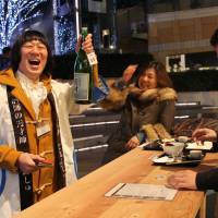 From left to right, comedian Asayan, Yurie Sato and Tomoaki Ishida at Craft Sake Week. | MONICA IRELAND