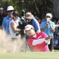 Harukyo Nomura plays out of a bunker at the Women\'s Australian Open in Adelaide, Australia, on Sunday. | KYODO