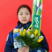 Sara Takanashi stands on the podium after finishing second at a ski jumping World Cup event in Ljubno, Slovenia, on Saturday. | KYODO