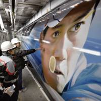 An illustration of world No. 6 tennis player Kei Nishikori adorns the side of a JAL plane scheduled to begin service from Tokyo to the U.S. and Europe on Thursday. Nishikori made the \"30 under 30\" list of top people in entertainment and sports released online Wednesday by Forbes\' Asia edition. | KYODO