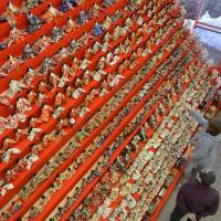 Visitors admire some 3,000 hina (dolls) displayed Friday at the Oigami hot spring resort in Numata, Gunma Prefecture, ahead of Girls\' Day on March 3, the day households traditionally put their hina collections on show. | KYODO