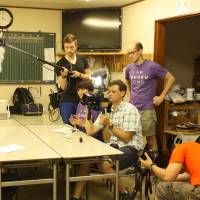 Wesley Julian (right, in the purple T-shirt) works with his crew during a shoot for this 113 Project. | COURTESY OF WESLEY JULIAN