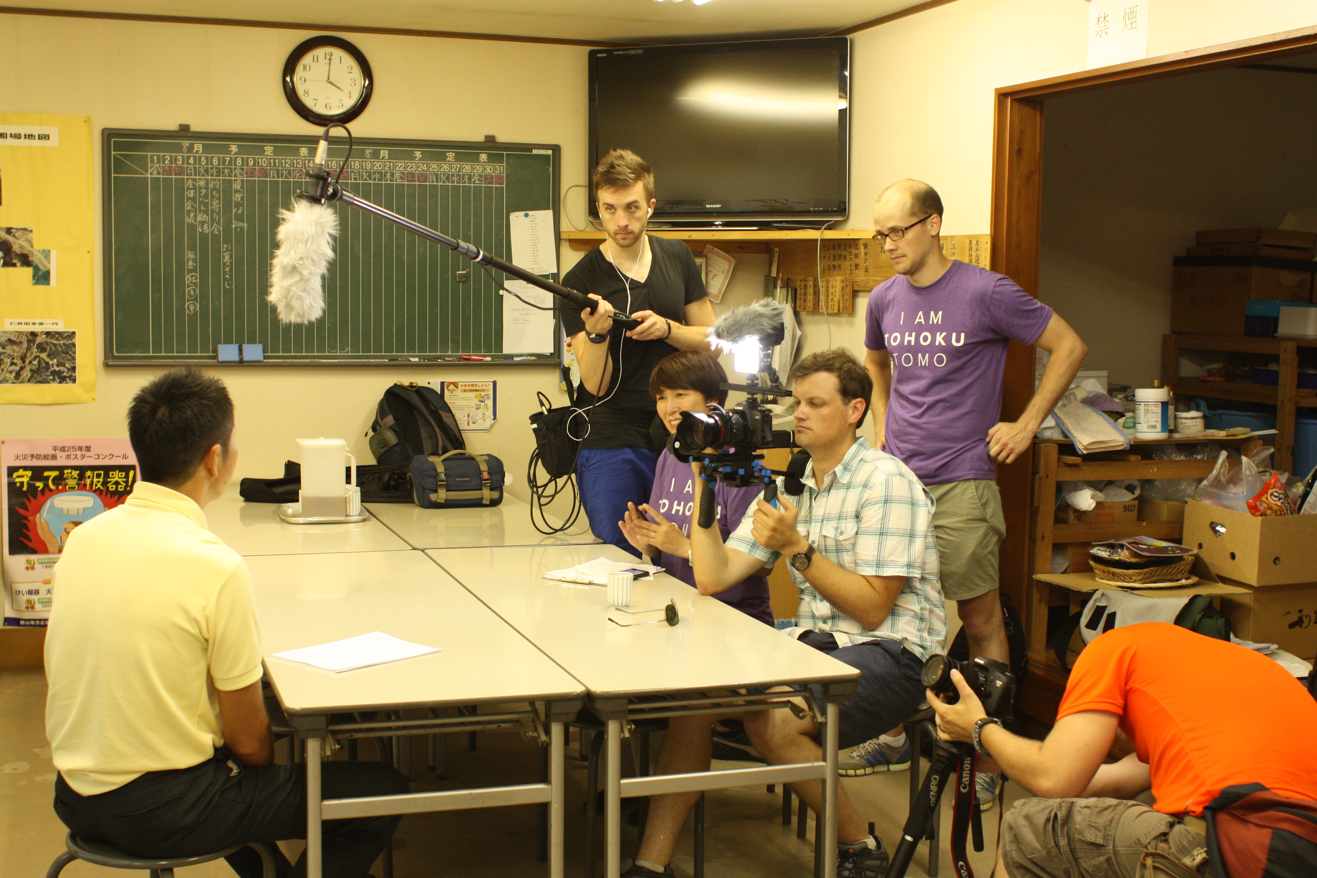 Wesley Julian (right, in the purple T-shirt) works with his crew during a shoot for this 113 Project. | COURTESY OF WESLEY JULIAN