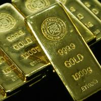 Gold ingots are pictured at a Tokuriki Honten Co., Ltd. showroom in Tokyo. Japan\'s biggest bullion retailer says the Bank of Japan\'s negative interest rates are boosting demand for gold. | BLOOMBERG