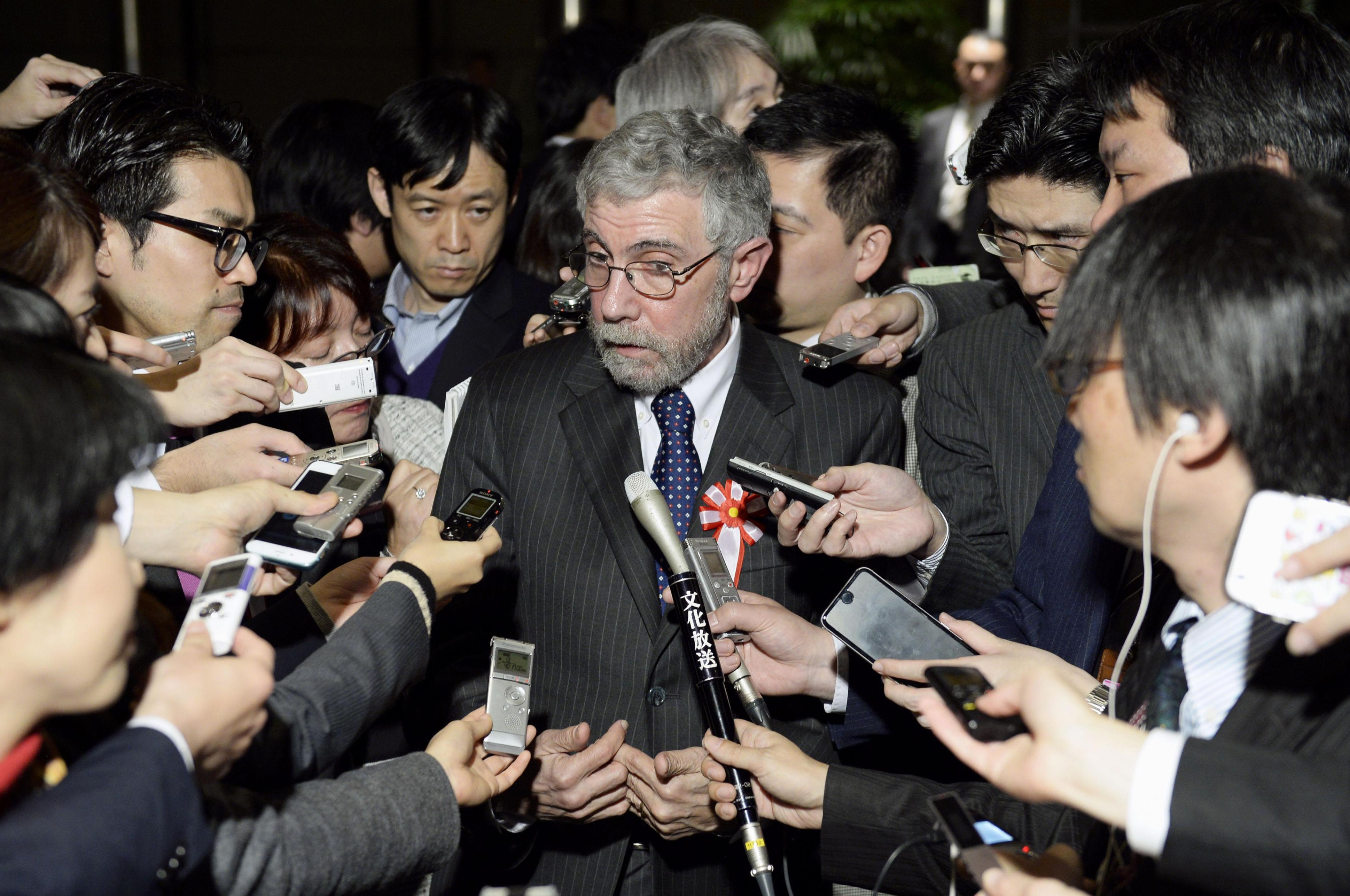 Economist Paul Krugman addresses reporters on Tuesday night after meeting with Prime Minister Shinzo Abe at his office in Tokyo. | KYODO