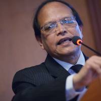 Bangladesh Central Bank Governor Atiur Rahman who resigned on Tuesday speaks during the IMF World Bank Annual Meeting in Washington in October 2014. | AFP-JIJI