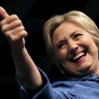 U.S. Democratic presidential candidate Hillary Clinton gives a thumbs-up as she takes the stage at her campaign rally in West Palm Beach, Florida, Tuesday. It was reported Thursday that she won the Missouri primary. | REUTERS