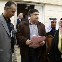 Amer al-Halloush, a member of of the Syrian Democratic Council, an alliance formed in December as the political branch of the Kurdish-Arab fighting force known as the Syrian Democratic Forces, heads out following a meeting of more than 150 delegates from Kurdish, Arab, Assyrian and other parties in the town of Rmeilan, in Syria\'s northeastern Hassakeh province, on Wednesday. | AFP-JIJI