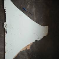 A piece of debris found on a sandbank in Mozambique is shown in an image released Thursday by an Australian government agency. The item is on its way to Australia for analysis. | ATSB