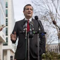 Republican presidential candidate Sen. Ted Cruz speaks to the media about events in Brussels Tuesday near the Capitol in Washington. Cruz said he would use the \"full force and fury\" of the U.S. military to defeat the Islamic State group. | AP