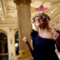 Rosemary Carver, a supporter of Republican presidential candidate Donald Trump, arrives at his primary election night event at the Mar-a-Lago Club in Palm Beach, Florida, Tuesday. | AP