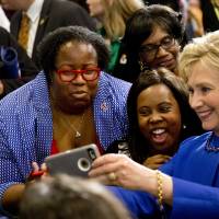 Democratic presidential candidate Hillary Clinton takes pictures with supporters after a Feb. 23 campaign event in Columbia, South Carolina. | AP