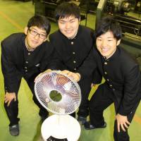 Takahiro Suzuki (left), Junichi Imahara (center) and Takumi Imaizumi of Aichi Prefectural Toyohashi Technical High School pose for a photo. With new toe-operated fan, students put their best feet forward