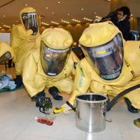 Firefighters in protective suits take part in an anti-chemical terrorism drill Wednesday in the city of Hiroshima, where the Group of Seven foreign ministers\' meeting will be held next month. | KYODO