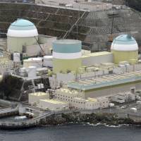 Shikoku Electric Power Co. is considering scrapping reactor 1 (center) of the Ikata nuclear power plant in Ehime Prefecture. | KYODO