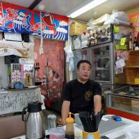 Masahiko Ueyama talks about the dwindling number of customers at his restaurant in the temporary Ogatsu shopping area in Ishinomaki, Miyagi Prefecture, on Feb. 14. | SATOKO KAWASAKI